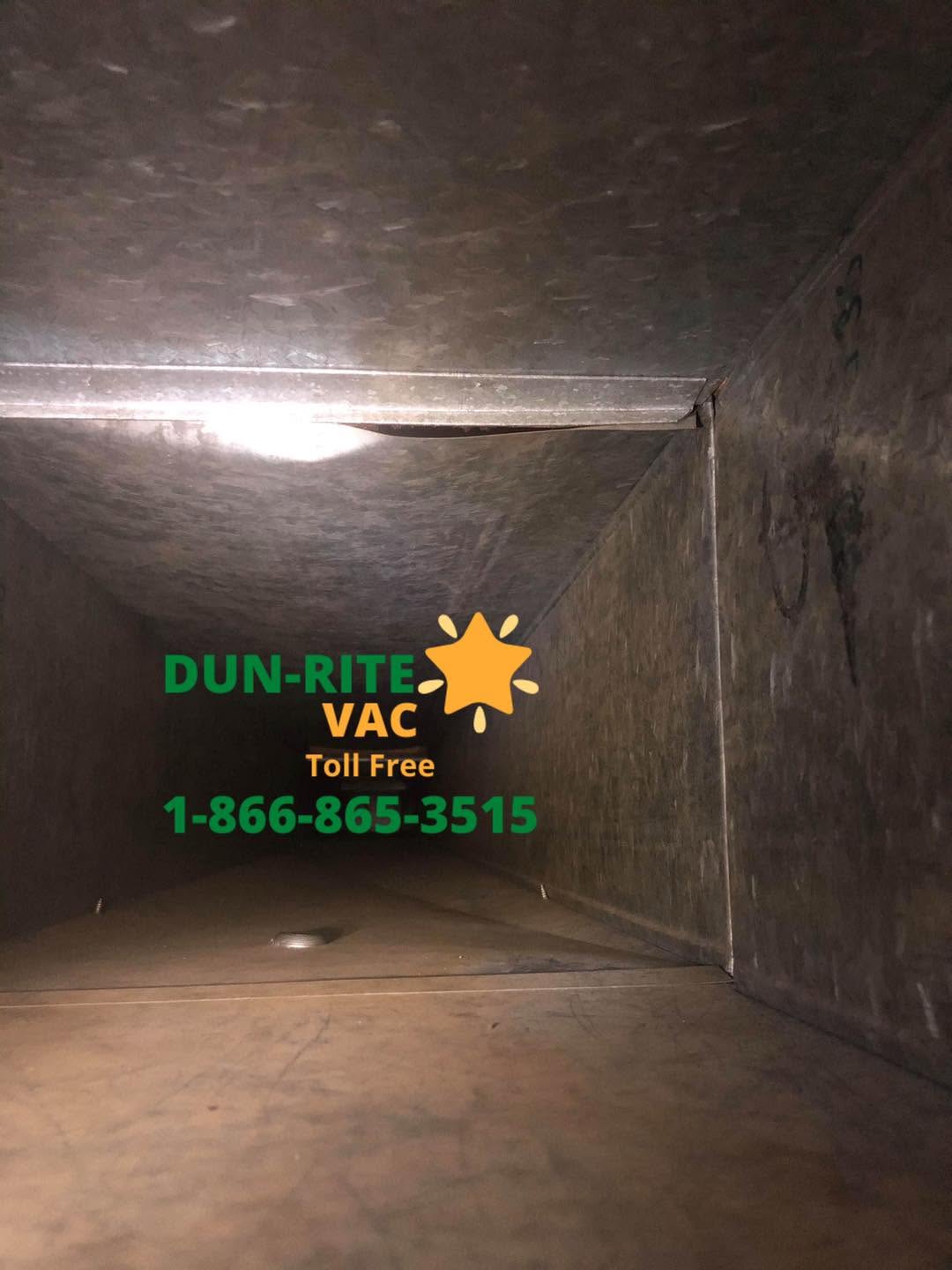 Interior of a residential air duct after professional cleaning with visible clean metal surfaces.