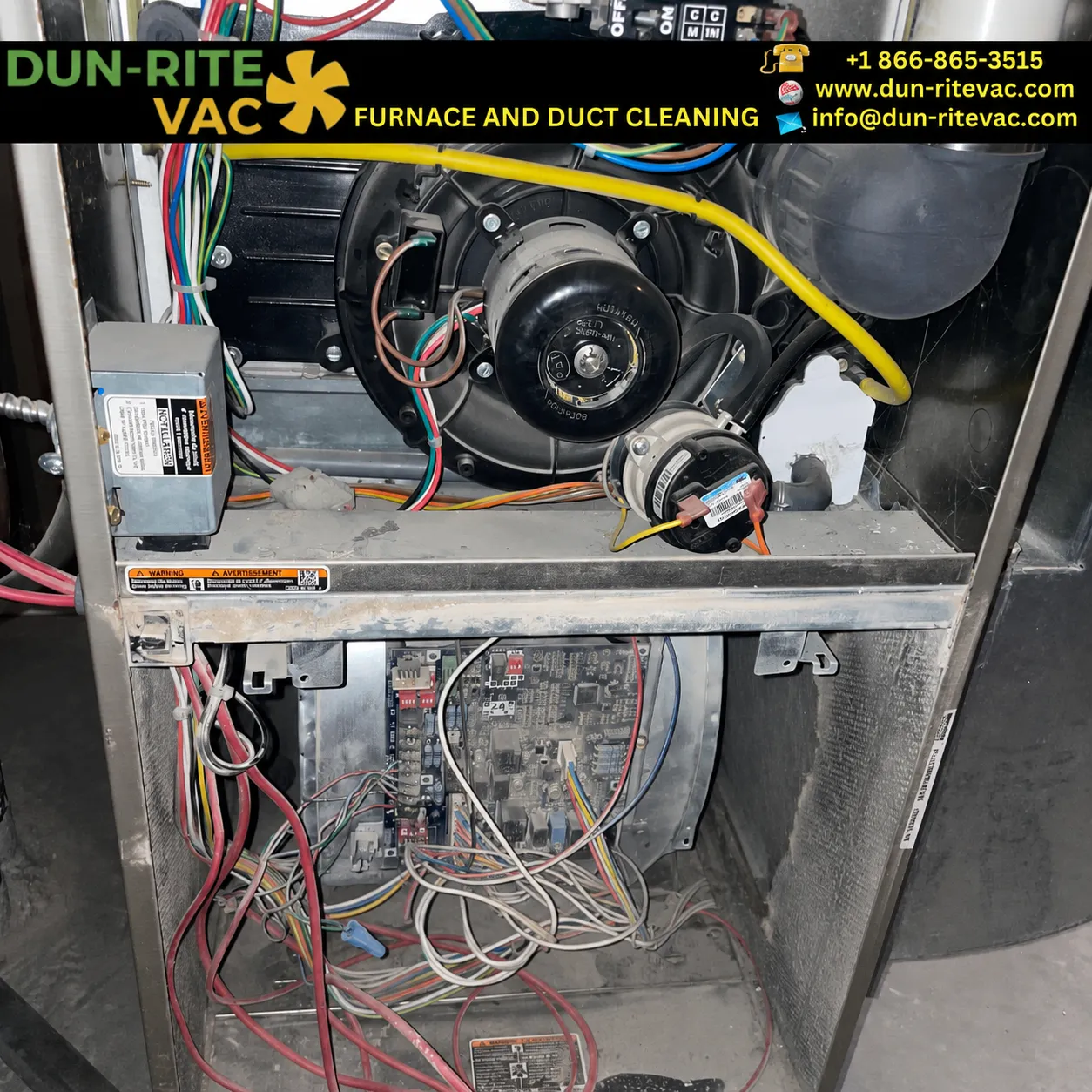 Interior of a furnace cabinet showing dust buildup on components before professional cleaning